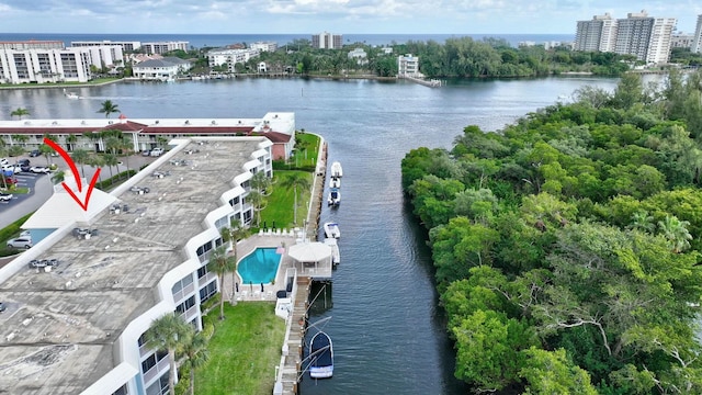 birds eye view of property with a water view