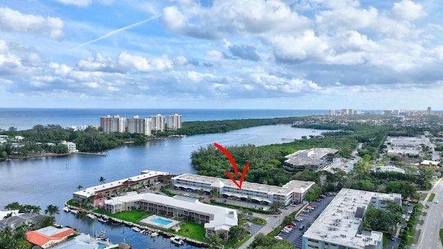 drone / aerial view featuring a water view and a city view