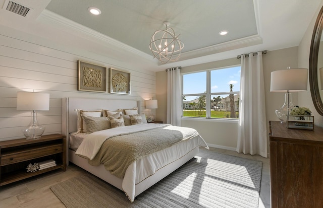 bedroom featuring visible vents, a tray ceiling, crown molding, a chandelier, and recessed lighting