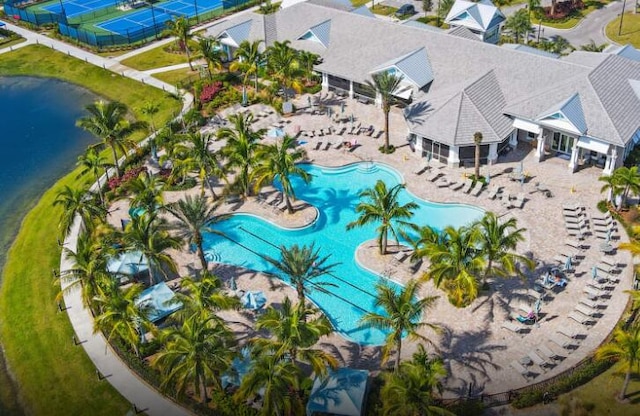 birds eye view of property with a water view