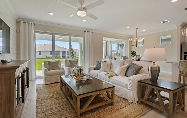 living area featuring ornamental molding, a wealth of natural light, and light tile patterned floors