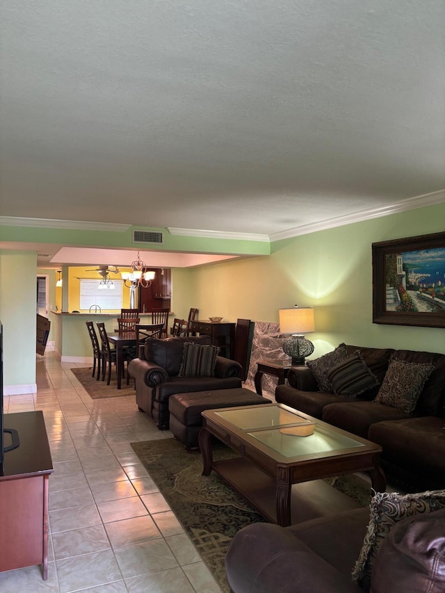 living area with light tile patterned floors, visible vents, and crown molding