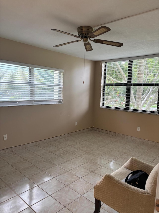 unfurnished room with a ceiling fan