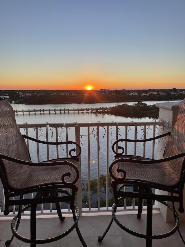 balcony featuring a water view