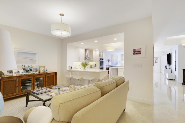 living room with baseboards and recessed lighting