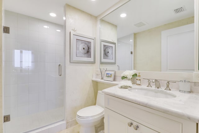 full bath featuring visible vents, toilet, vanity, a shower stall, and recessed lighting