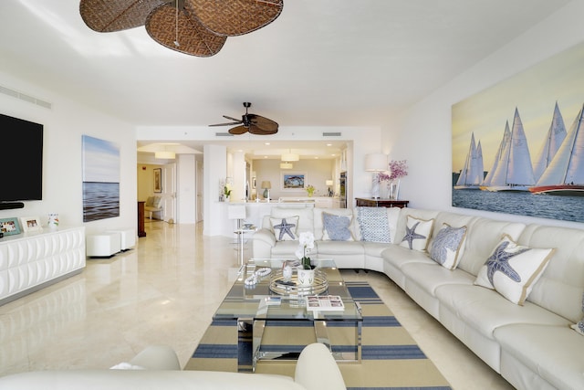 living room featuring visible vents and ceiling fan