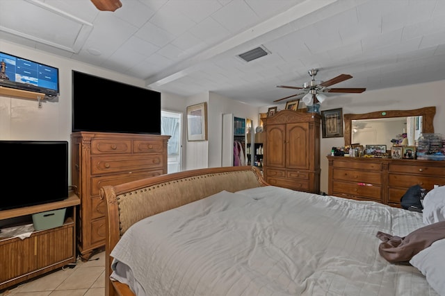 bedroom featuring visible vents, ceiling fan, and light tile patterned floors