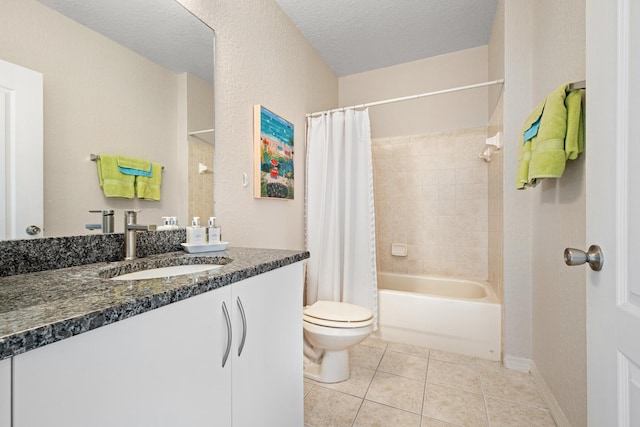 full bathroom featuring a textured ceiling, tile patterned flooring, toilet, vanity, and shower / bath combo