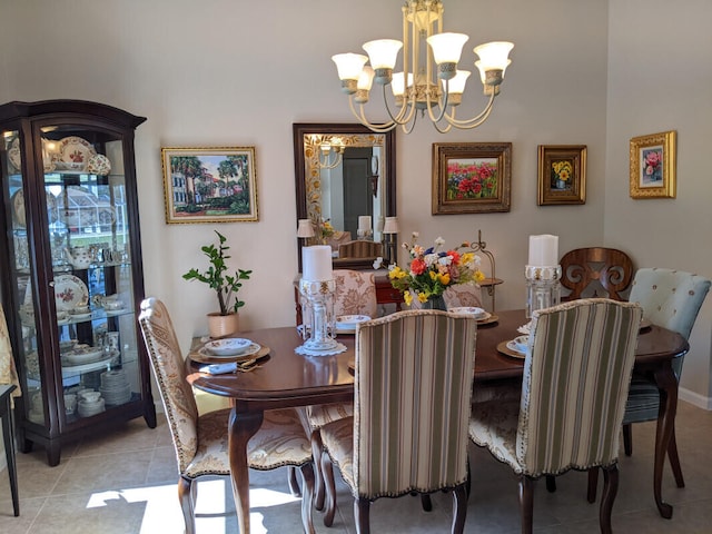 dining room featuring light tile patterned floors and a chandelier