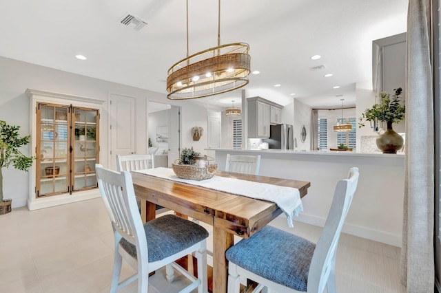 dining area featuring baseboards, visible vents, and recessed lighting