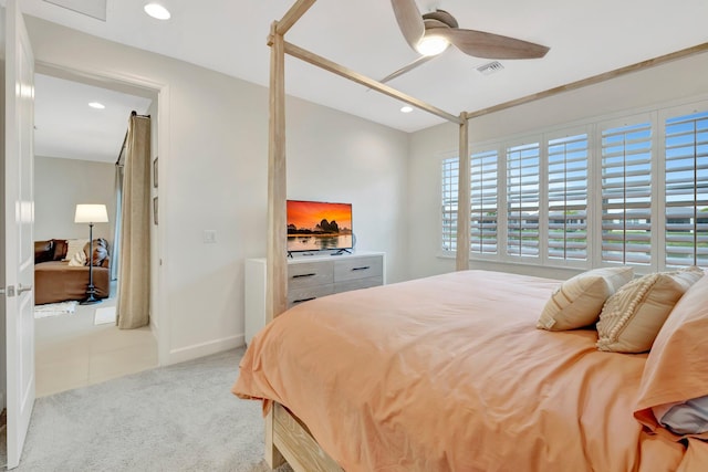 bedroom with light colored carpet, visible vents, baseboards, and recessed lighting