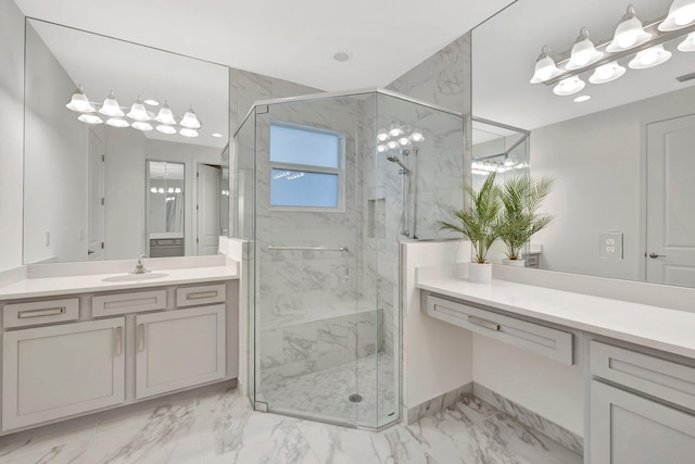 bathroom featuring visible vents, marble finish floor, a marble finish shower, and vanity