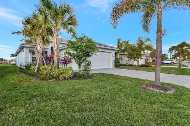 view of side of home with a garage, a lawn, driveway, and stucco siding