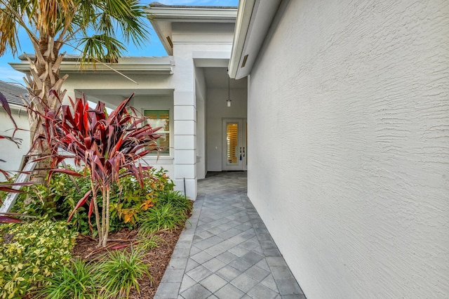 entrance to property with stucco siding