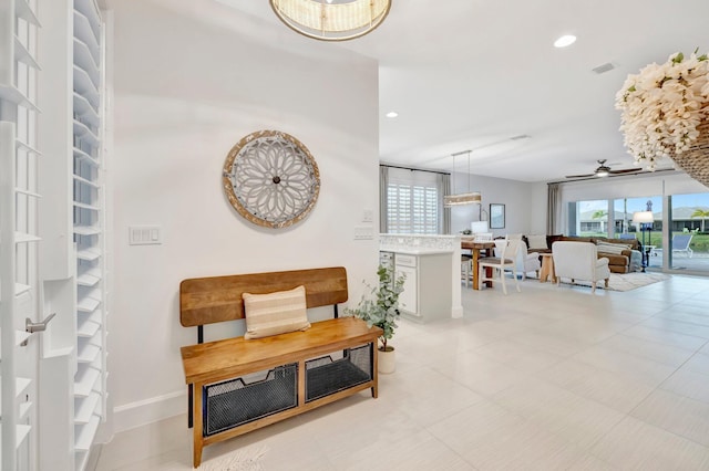 living area with baseboards, visible vents, a ceiling fan, and recessed lighting