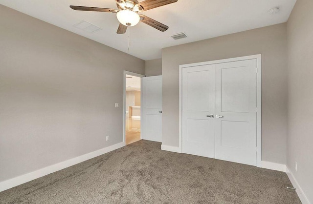 unfurnished bedroom featuring carpet floors, a closet, visible vents, a ceiling fan, and baseboards