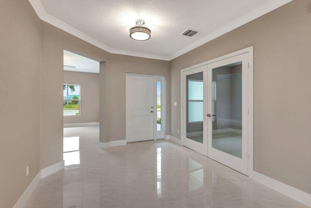 entryway featuring visible vents, baseboards, french doors, a textured ceiling, and crown molding