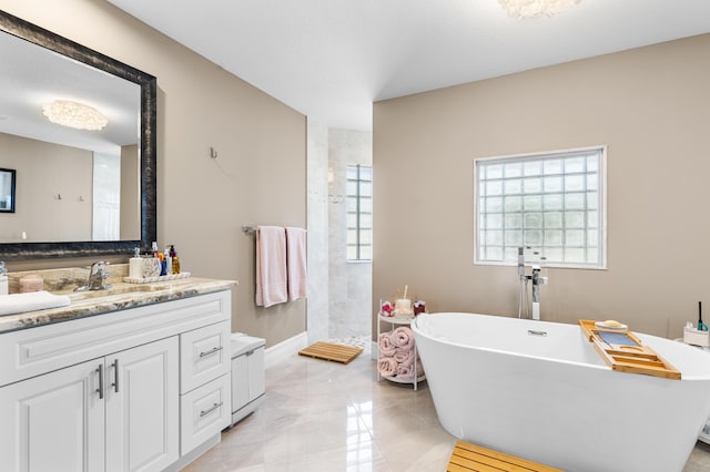 full bath featuring vanity, baseboards, a freestanding bath, marble finish floor, and walk in shower