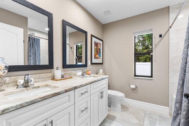 full bath with a shower with curtain, visible vents, a sink, and double vanity