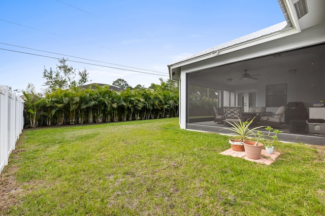 view of yard featuring a patio area, a fenced backyard, and a ceiling fan