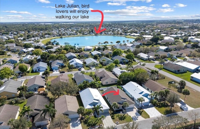 bird's eye view featuring a water view and a residential view