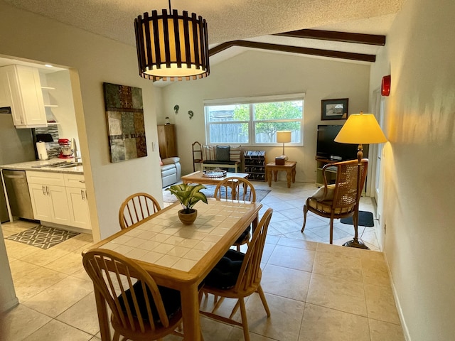 dining area with vaulted ceiling with beams, light tile patterned floors, a textured ceiling, and baseboards