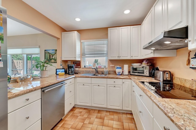 kitchen featuring white cabinets, black electric cooktop, stainless steel dishwasher, under cabinet range hood, and a sink