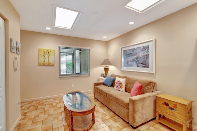 living room with recessed lighting, baseboards, and a skylight