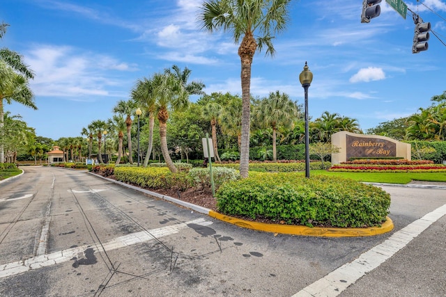 exterior space featuring street lighting and curbs