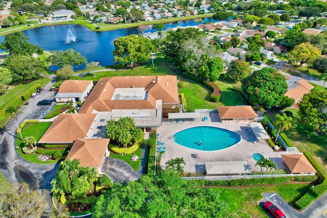 birds eye view of property with a water view and a residential view