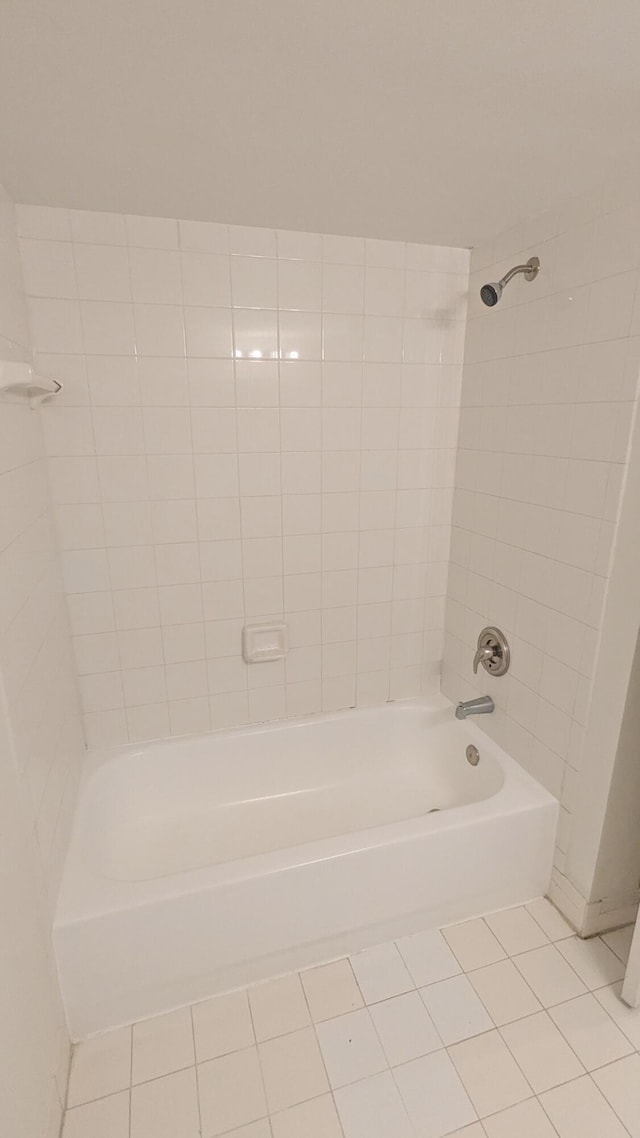 full bath featuring tile patterned flooring and shower / washtub combination