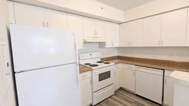 kitchen featuring a textured ceiling, under cabinet range hood, white appliances, light wood-style floors, and white cabinets