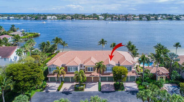 birds eye view of property with a water view