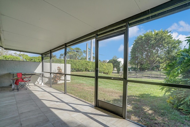 unfurnished sunroom with plenty of natural light