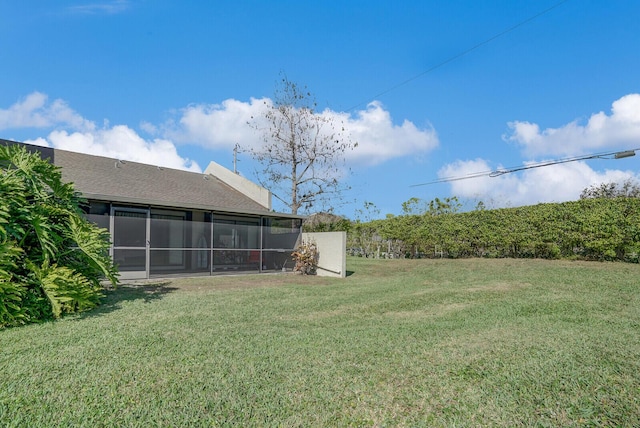 view of yard featuring a sunroom