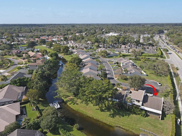 aerial view featuring a residential view and a water view