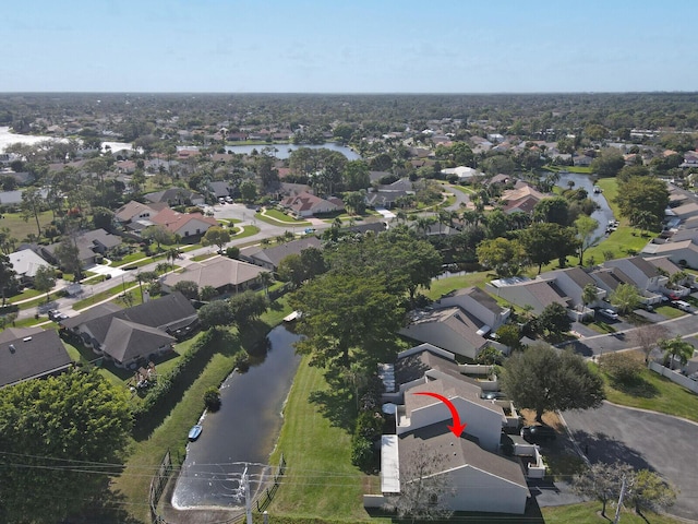 aerial view featuring a residential view and a water view