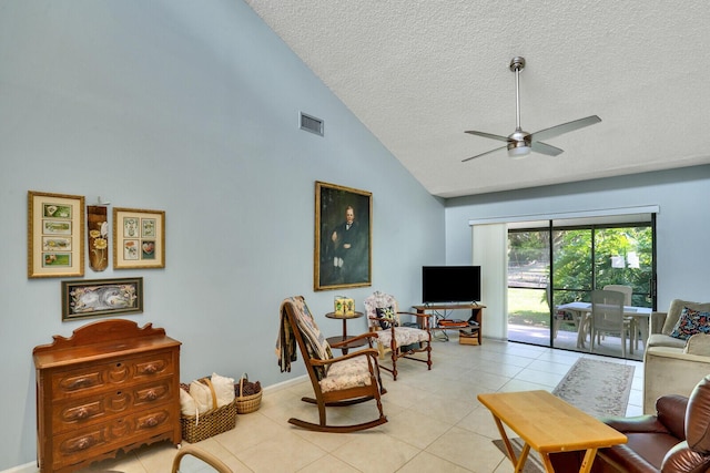 living room with light tile patterned floors, visible vents, ceiling fan, a textured ceiling, and high vaulted ceiling