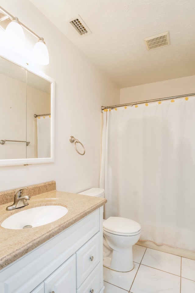 full bathroom with toilet, visible vents, and vanity