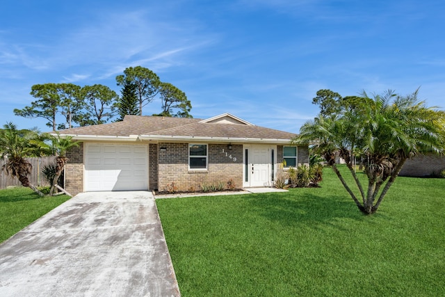 ranch-style house with a garage, brick siding, fence, concrete driveway, and a front yard