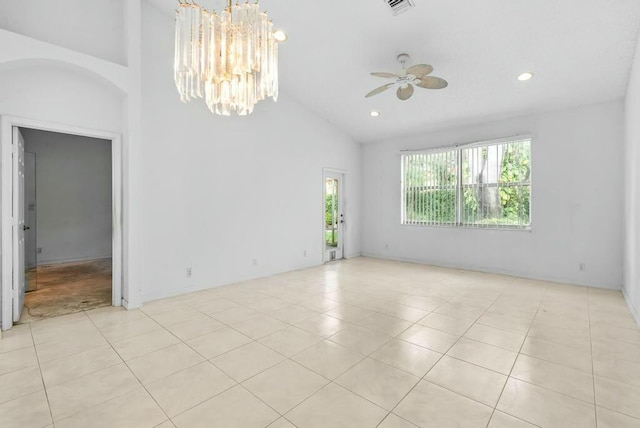 unfurnished room featuring high vaulted ceiling, recessed lighting, light tile patterned floors, and ceiling fan with notable chandelier