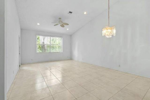 spare room with visible vents, recessed lighting, light tile patterned flooring, and ceiling fan with notable chandelier