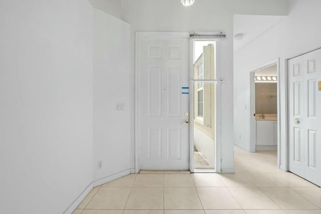 entrance foyer with light tile patterned flooring
