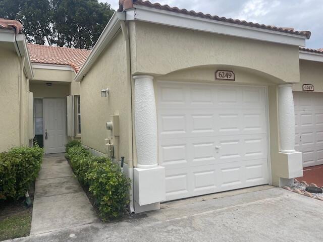 garage featuring driveway