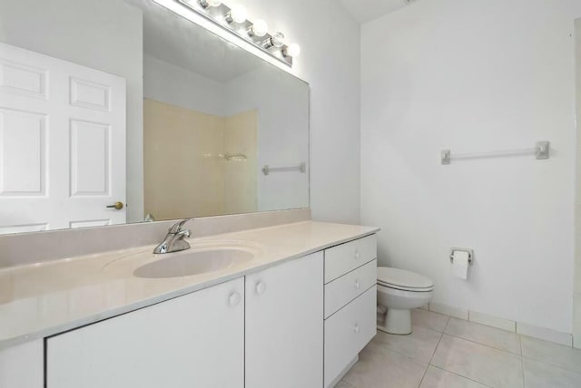 bathroom featuring tile patterned flooring, vanity, walk in shower, and toilet