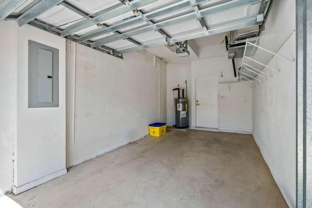 garage featuring a garage door opener, electric panel, and water heater