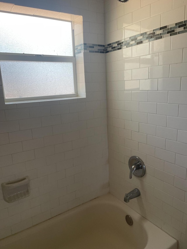 bathroom featuring  shower combination