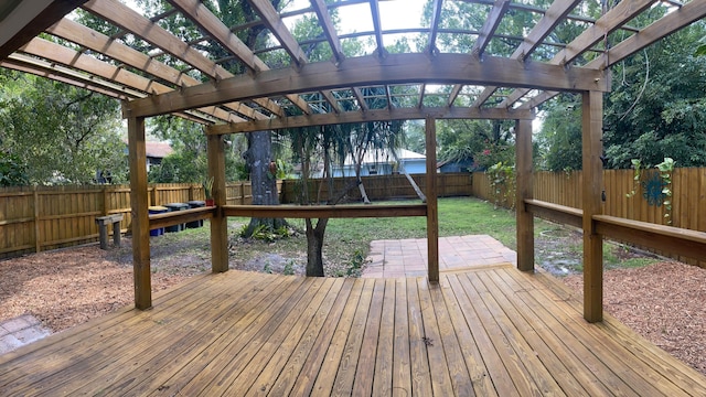 deck featuring a patio area, a fenced backyard, and a pergola