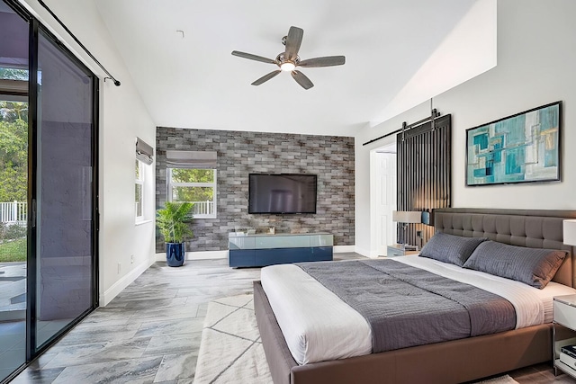 bedroom with a barn door, an accent wall, baseboards, vaulted ceiling, and access to outside